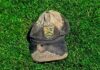 old cricket cap on grass